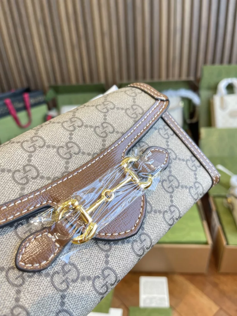 The Gucci March of Love collection is a new interpretation of the brand's iconic elements, paying tribute to the enduring glamour of Hollywood. This bag is part of Gucci's Horsebit, 1955 collection, and its miniature shape adds to the collection's signature accessories. 18cm (W) x 12cm (H) x 5cm (D)