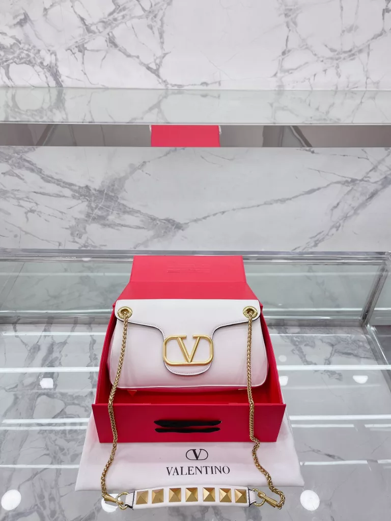 VALENTINO Women's Locò Calfskin Handbag Handbag Crossbody<br>The new Rockstud Alcove accessories collection<br>The iconic vlogo Signature is an avant-garde shape that creates a unique and seductive appeal.<br>Stud Sign Modern 