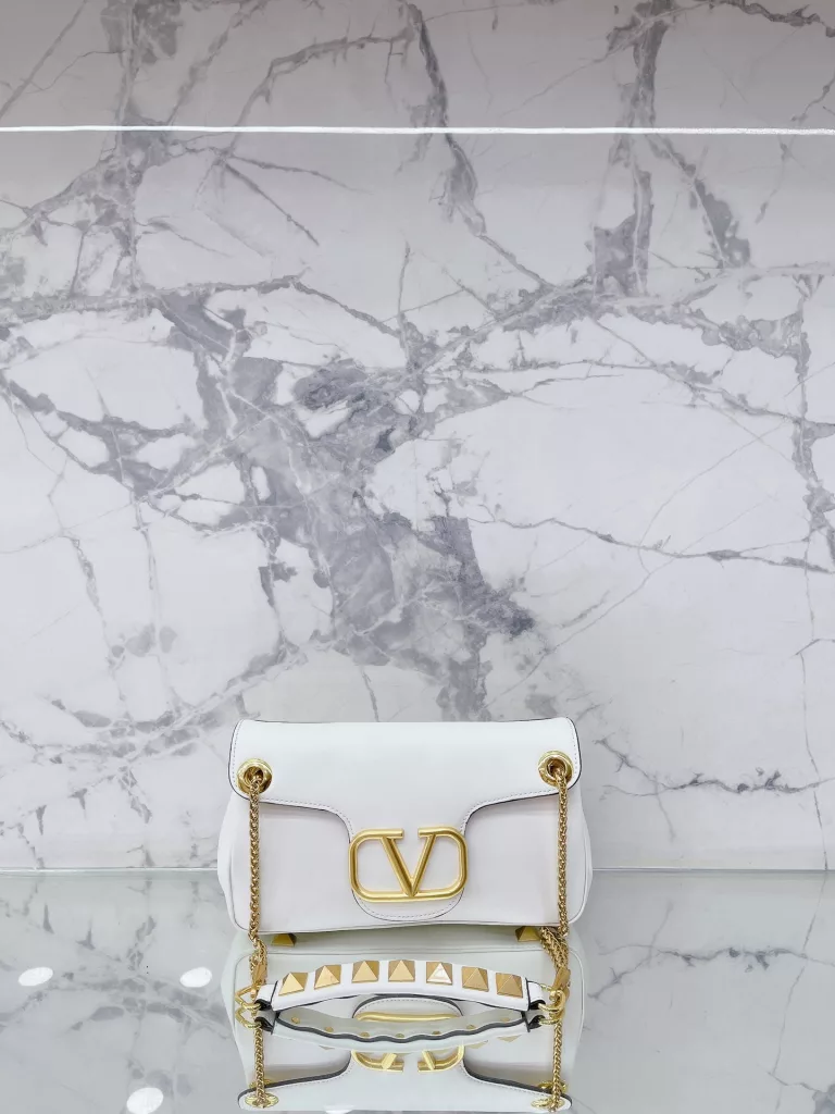 VALENTINO Women's Locò Calfskin Handbag Handbag Crossbody<br>The new Rockstud Alcove accessories collection<br>The iconic vlogo Signature is an avant-garde shape that creates a unique and seductive appeal.<br>Stud Sign Modern 