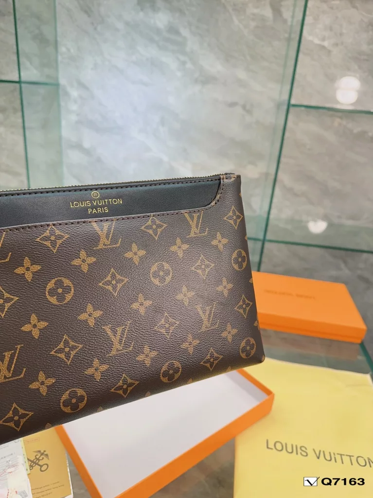 Lv Clutch Collection Clutch Bag The Pochette To-Go Clutch is a trendy alternative to traditional handbags and briefcases. Plenty of room for your phone and personal needs with a removable wrist strap. Size: 28 19