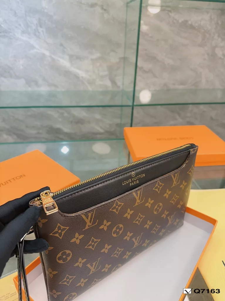 Lv Clutch Collection Clutch Bag The Pochette To-Go Clutch is a trendy alternative to traditional handbags and briefcases. Plenty of room for your phone and personal needs with a removable wrist strap. Size: 28 19