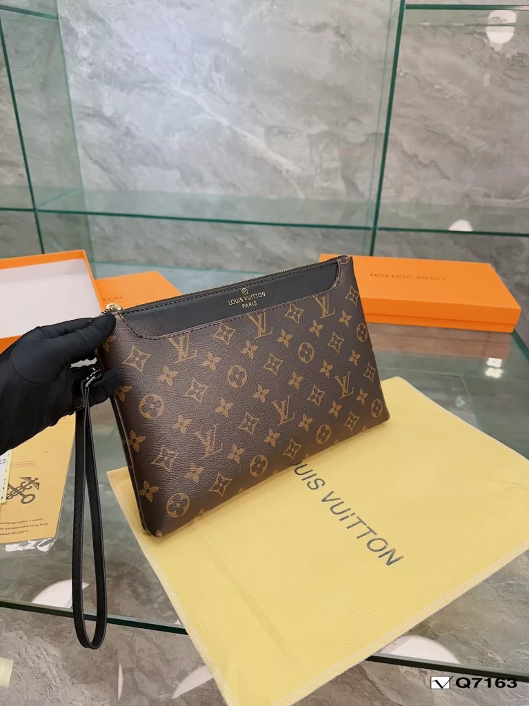 Lv Clutch Collection Clutch Bag The Pochette To-Go Clutch is a trendy alternative to traditional handbags and briefcases. Plenty of room for your phone and personal needs with a removable wrist strap. Size: 28 19