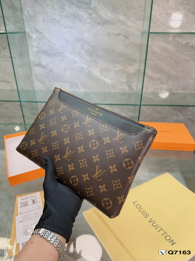 Lv Clutch Collection Clutch Bag The Pochette To-Go Clutch is a trendy alternative to traditional handbags and briefcases. Plenty of room for your phone and personal needs with a removable wrist strap. Size: 28 19