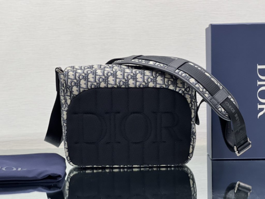 This Dior Explorer bag takes inspiration from the classic logo of the timeless messenger bag and reinterprets it in a high-staple version. Crafted in the signature beige and black Oblique print jacquard, it is accented with multiple logos and 