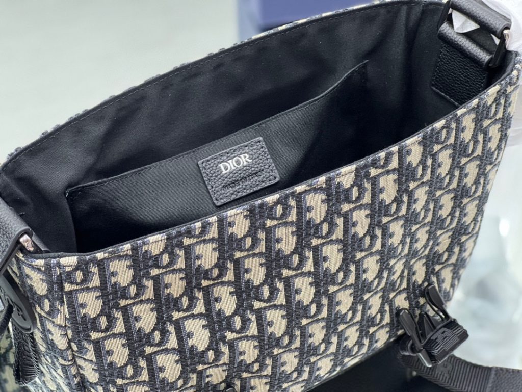 This Dior Explorer bag takes inspiration from the classic logo of the timeless messenger bag and reinterprets it in a high-staple version. Crafted in the signature beige and black Oblique print jacquard, it is accented with multiple logos and 