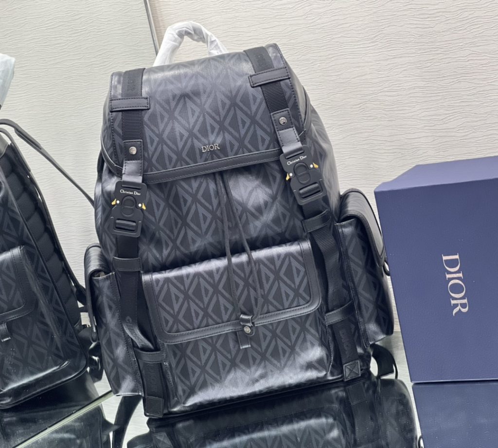 This Dior Hit the Road backpack is a new style this season, combining modern style with Dio's high order spirit. Made with Dio Black CD Diamond canvas, inspired by Dio archives, and decorated with smooth cow leather details. Pair with two 