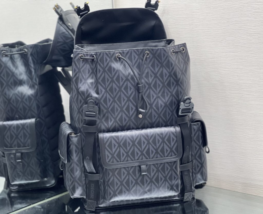 This Dior Hit the Road backpack is a new style this season, combining modern style with Dio's high order spirit. Made with Dio Black CD Diamond canvas, inspired by Dio archives, and decorated with smooth cow leather details. Pair with two 