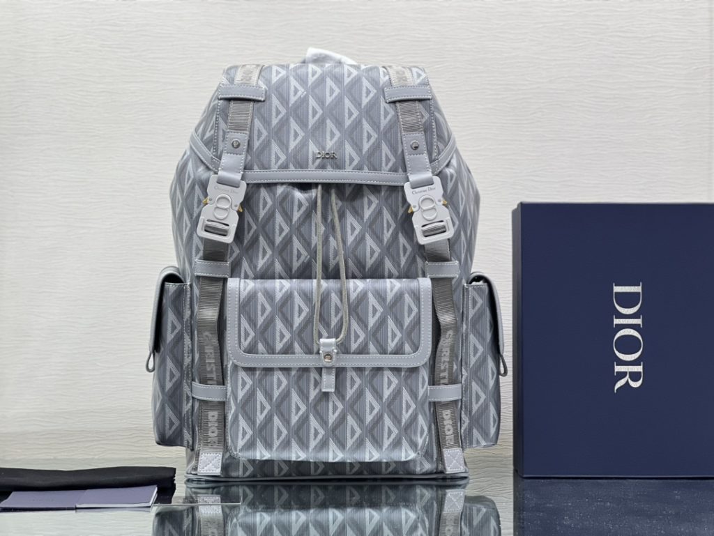 This Dior Hit the Road backpack is a new style this season, combining modern style with Dio's high order spirit. Made with Dio Black CD Diamond canvas, inspired by Dio archives, and decorated with smooth cow leather details. Pair with two 