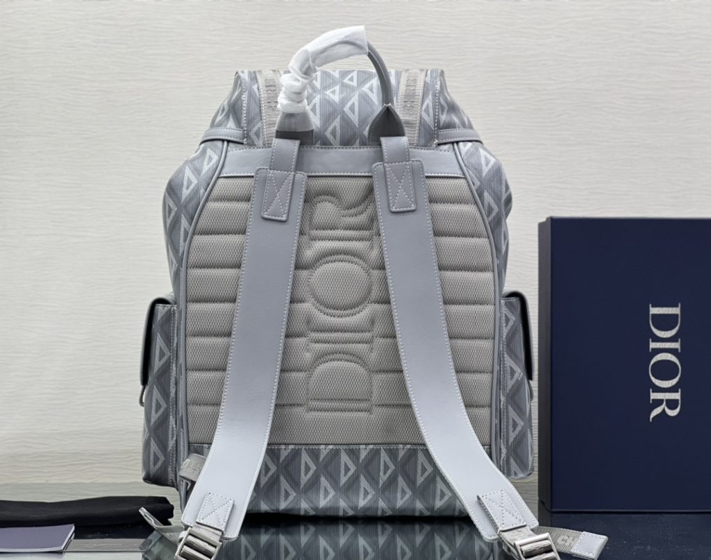 This Dior Hit the Road backpack is a new style this season, combining modern style with Dio's high order spirit. Made with Dio Black CD Diamond canvas, inspired by Dio archives, and decorated with smooth cow leather details. Pair with two 