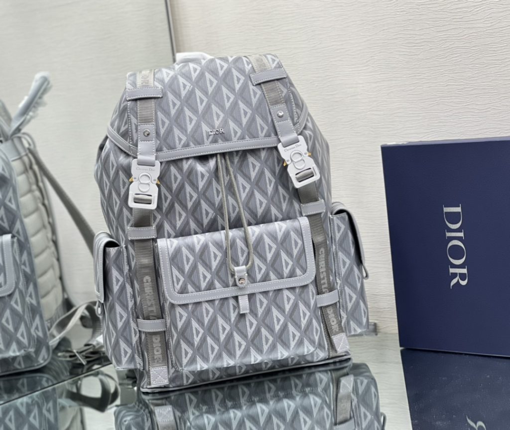 This Dior Hit the Road backpack is a new style this season, combining modern style with Dio's high order spirit. Made with Dio Black CD Diamond canvas, inspired by Dio archives, and decorated with smooth cow leather details. Pair with two 