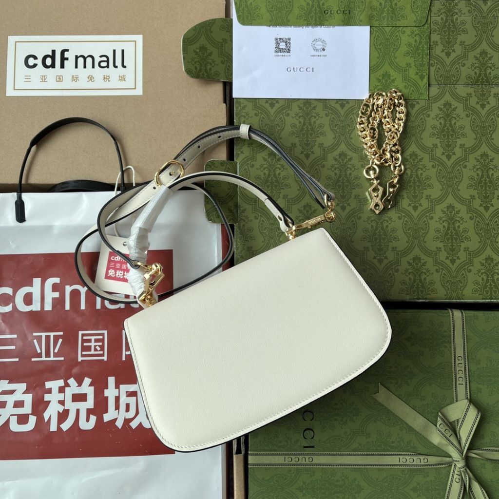 📣📣📣 [Original leather 🌈 (Cdfmall Sanya duty-free shop handbag] 🔥🔥 Gucci Blondie series handbag, UXX0G 1000 vintage elements and collection details complement each other. This backpack is made of white glossy leather, with exquisite chain design, showing the classic and meaningful modern flavor. As a collection design element, the round interlocking double G is decorated on the buckle in the center of this piece. White leather, gold adjustable accessories, round interlocking double G, interior: 1 zip pocket, 2 open pockets, top handle, with chain shoulder strap, leather shoulder strap, press buckle. Model: 735101. Size: 23 (W) x 15 (H) x 11cm (D) Color: black/original leather. Italian creation