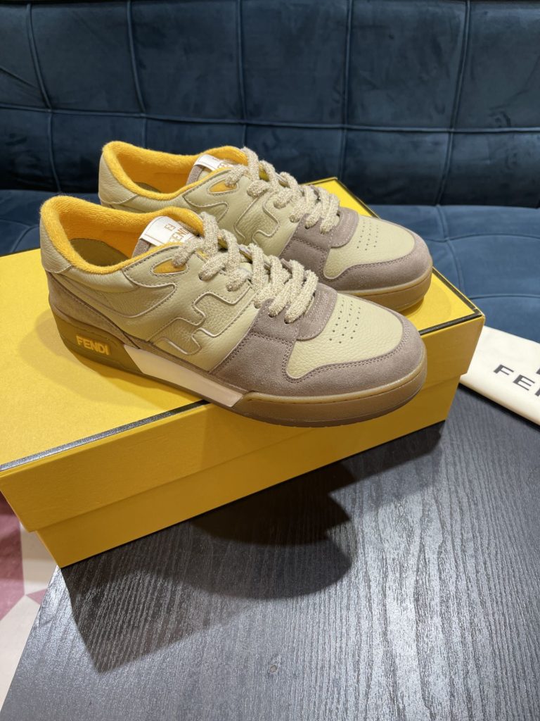 Fendi Match lace-up sneakers. Made of black suede and white leather, with white and black bird check fabric details. Rubber sole with Fendi on the side Size 39-44