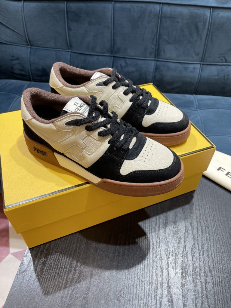 Fendi Match lace-up sneakers. Made of black suede and white leather, with white and black bird check fabric details. Rubber sole with Fendi on the side Size 39-44