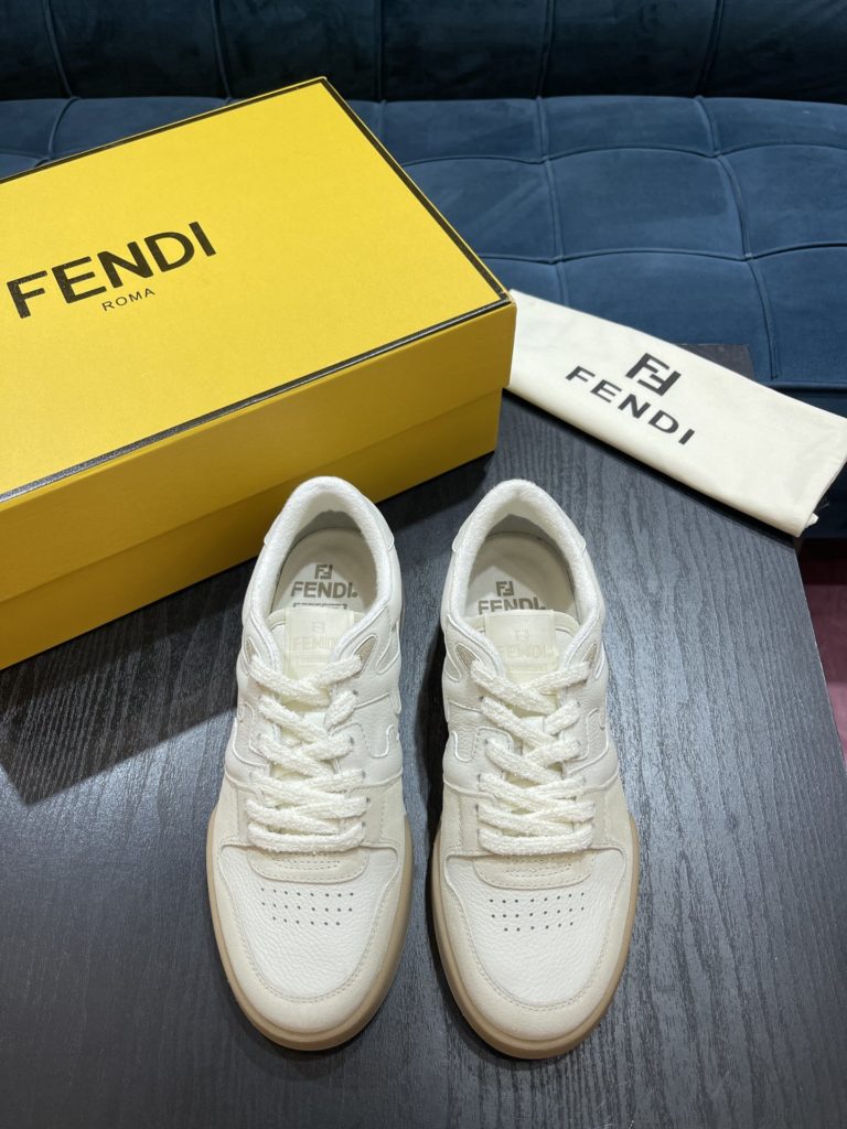 Fendi Match compact design sneaker with retro label on the tongue. The side is decorated with FF pattern stitching and Fendi embossing on the sole. White suede and leather. Decorated with the same color lace lace and lace. Rubber covered sole with beige cushioning material. Size 39-44