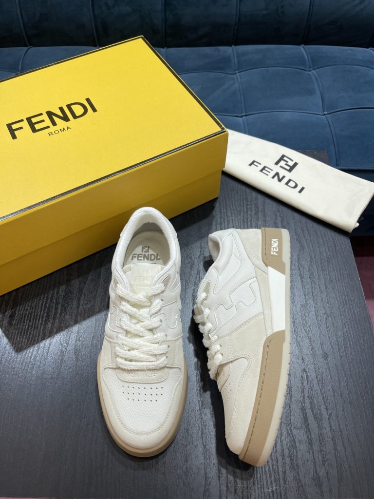 Fendi Match compact design sneaker with retro label on the tongue. The side is decorated with FF pattern stitching and Fendi embossing on the sole. White suede and leather. Decorated with the same color lace lace and lace. Rubber covered sole with beige cushioning material. Size 39-44