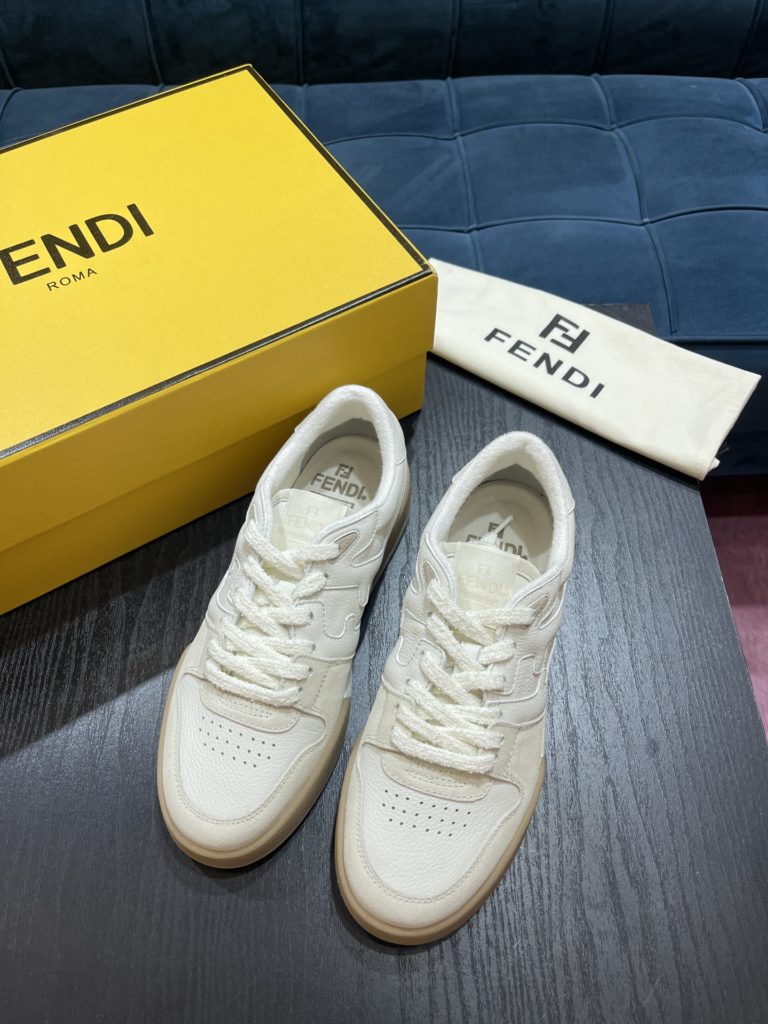 Fendi Match compact design sneaker with retro label on the tongue. The side is decorated with FF pattern stitching and Fendi embossing on the sole. White suede and leather. Decorated with the same color lace lace and lace. Rubber covered sole with beige cushioning material. Size 39-44