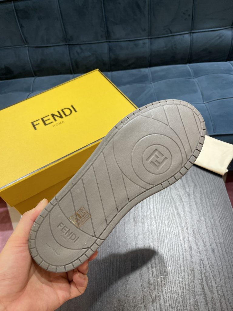 Fendi Match compact design sneaker with retro label on the tongue. The side is decorated with FF pattern stitching and Fendi embossing on the sole. White suede and leather. Decorated with the same color lace lace and lace. Rubber covered sole with beige cushioning material. Size 39-44