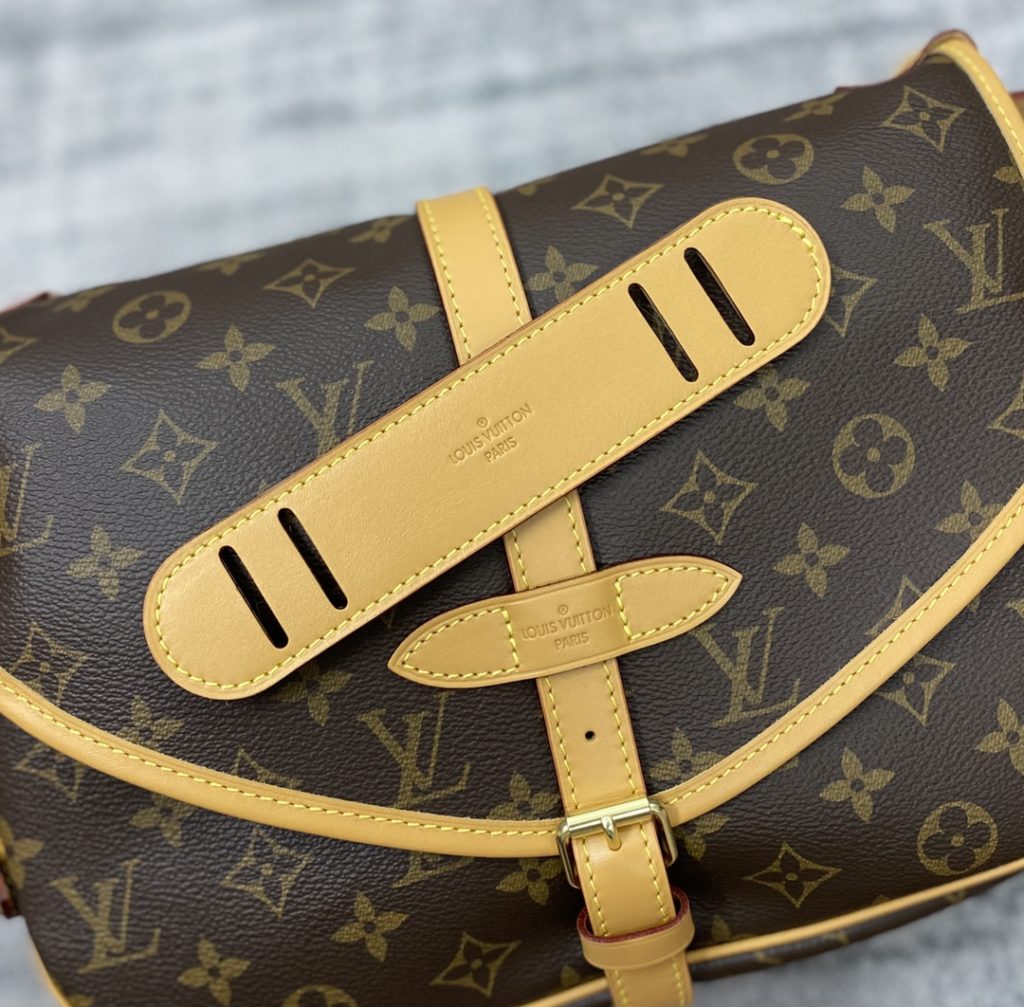 The M40710 Gemini Medieval Series SAUMUR Medium Handbag is made of Monogram canvas. The Saumur Medium Handbag demonstrates the natural elegance of Louis Vuitton. The casual cross body style is more fashionable and appealing, with delicate cowhide trim outlining a very feminine appearance. Size: 28x11x20