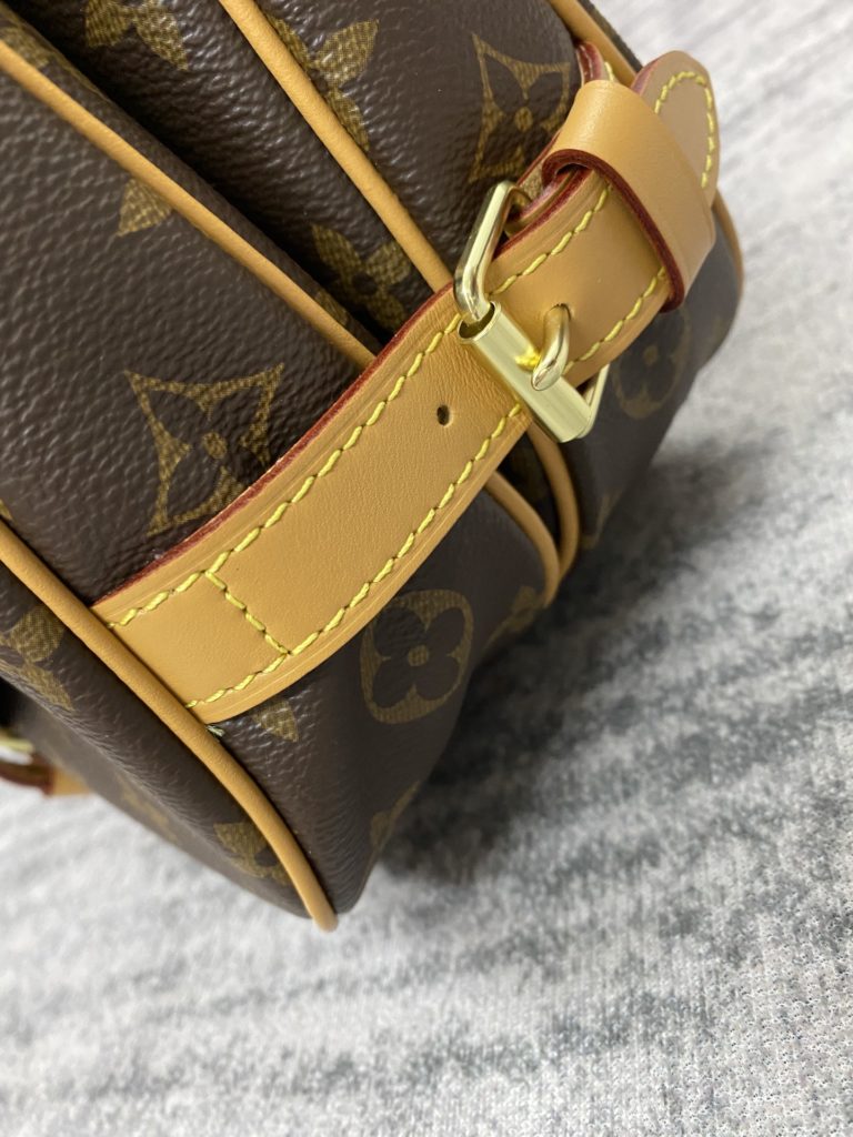 The M40710 Gemini Medieval Series SAUMUR Medium Handbag is made of Monogram canvas. The Saumur Medium Handbag demonstrates the natural elegance of Louis Vuitton. The casual cross body style is more fashionable and appealing, with delicate cowhide trim outlining a very feminine appearance. Size: 28x11x20