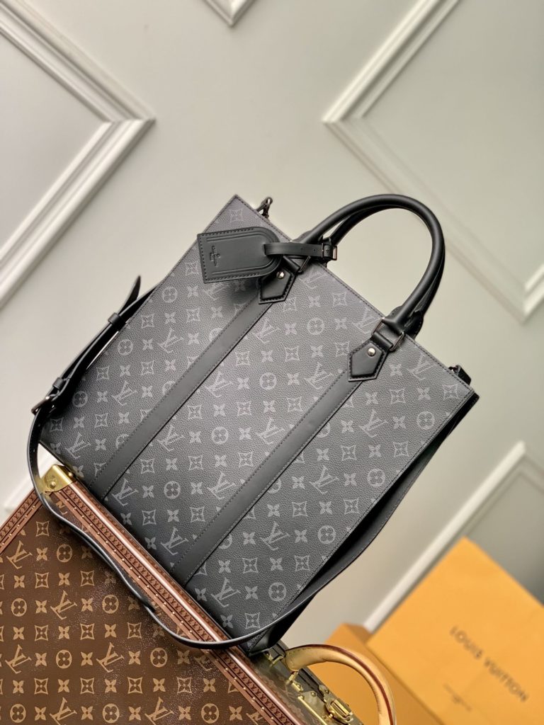 The Sac Plat handbag is made with Monogram Eclipse coated canvas to create a slim silhouette with wide lace for a trendy look in business settings. Padded interior with pockets and D-rings for easy attachment of removable shoulder straps. 36.5 x 38.0 x 9.0 cm (L x H x W)