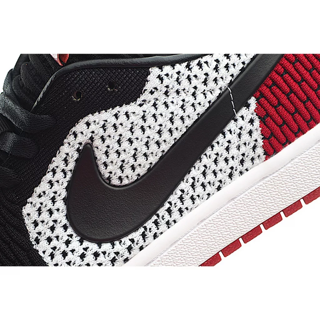 NK Air Jordan 1 Retro low Flyknit AJ1 low cut black, white, and red shoes are made of fly knit material on the face, with a top layer of cowhide on the inner lining and heel