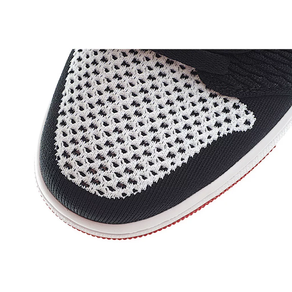 NK Air Jordan 1 Retro low Flyknit AJ1 low cut black, white, and red shoes are made of fly knit material on the face, with a top layer of cowhide on the inner lining and heel