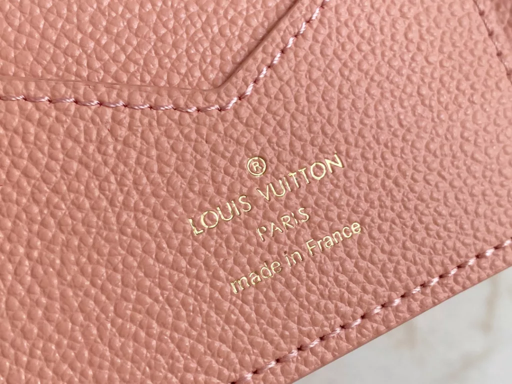 The M46290 pink full leather passport wallet series is the perfect companion for fashionable travel. The luxurious grain grain grain calf leather lining, with multiple compartments inside, is a classic travel accessory in style. Transform this elegant passport case into a cute avatar. 10.0 x 14.0 x 2.5 cm.