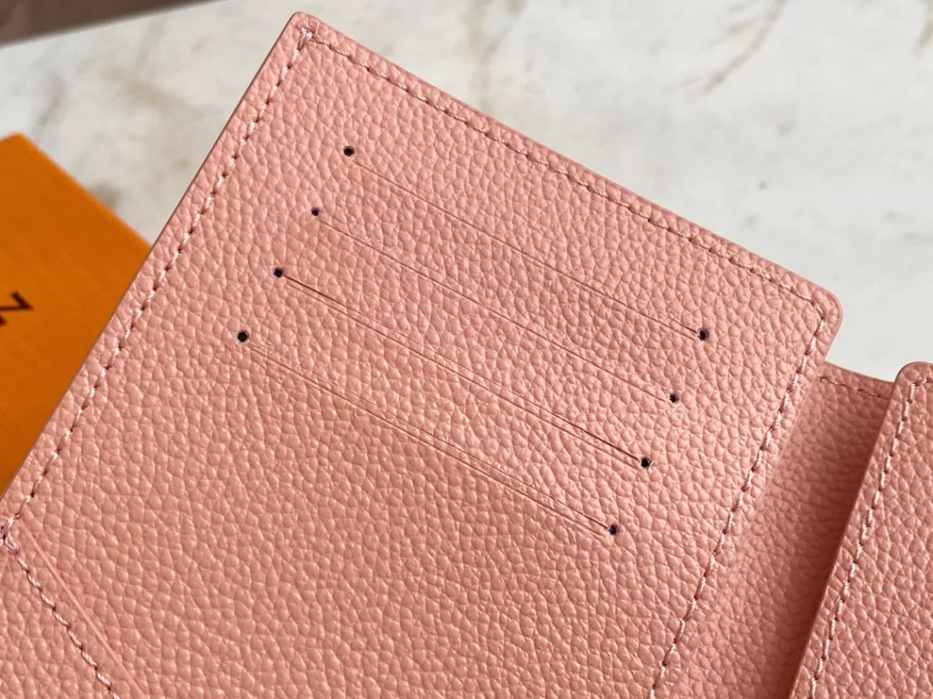 The M46290 pink full leather passport wallet series is the perfect companion for fashionable travel. The luxurious grain grain grain calf leather lining, with multiple compartments inside, is a classic travel accessory in style. Transform this elegant passport case into a cute avatar. 10.0 x 14.0 x 2.5 cm.