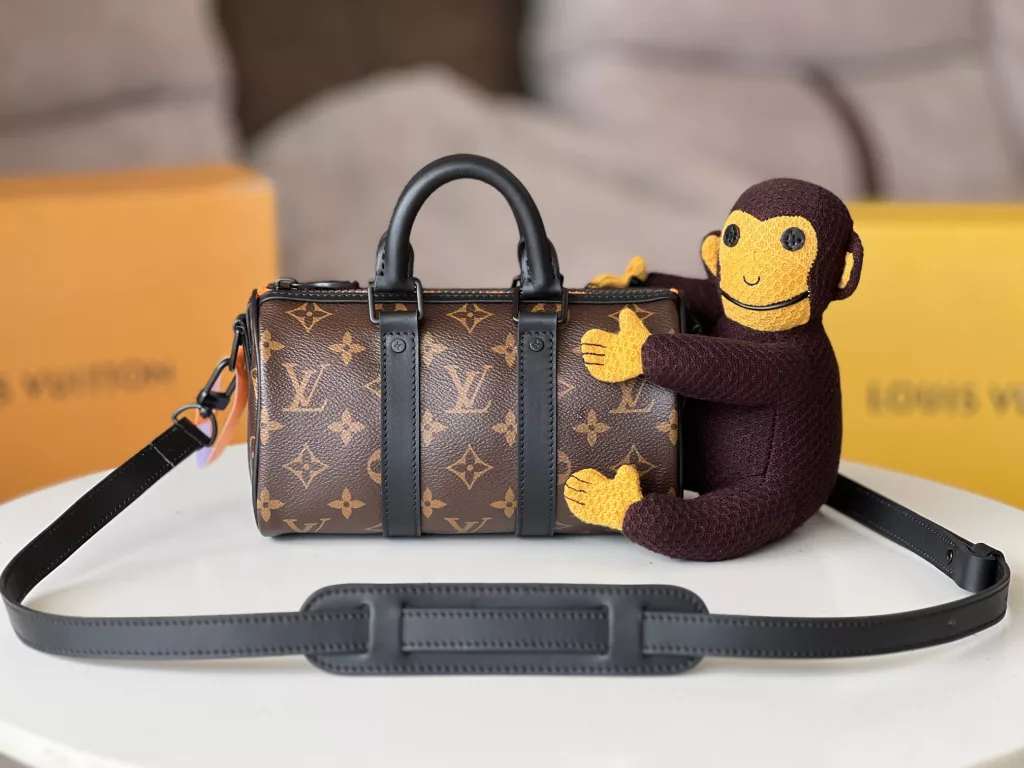 KEEPALL NANO Handbag M80118 Monkey doll In the Spring/Summer 2021 collection, menswear art director Virgil Abloh presents the Keepall Nano handbag. The bag comes with a knitted doll of Louis Vuitton's friends cartoon character from its 