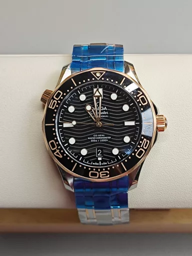 VS Omega Gold Seamaster 300 Black Dial