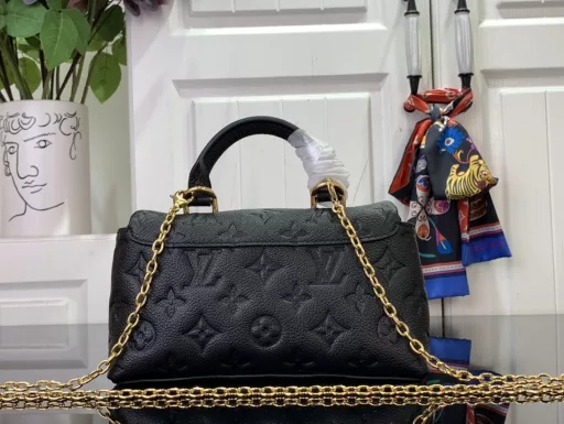 This Nano Madeleine bag is a miniature version of the Madeleine bag in Monogram Empreinte leather, with a classic S-lock clasp and a removable chain embellished with the LV Circle logo. It has plenty of room for everyday necessities and can be carried by hand, on the shoulder or across the body.