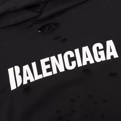 Balenciaga Cracked Letters Hole Hooded Artistic HoodieBrick Cabinet Synchronized in Autumn and Winter. Welcome to compare. The fabric is made of Paris ZP custom-woven and dyed all-cotton washed sweater, with clear fabric texture,soft and comfortable. The thread is custom-woven and dyed without color difference.The classic letter LOGO uses a precision screen. Imported n environmentally friendly rubber paddle. Cracked pattern printing, the effect is three-dimensional.The ready-made garment is positioned with artistic worn holes, hem threads, hat brim, and pocket openings are hand-worn retro. Restore the brick cabinet,The pattern uses the OS loose drop shoulder pattern. Unisex style